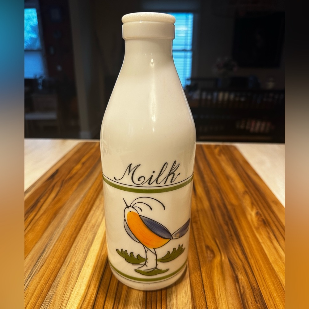Vintage milk bottle with bird